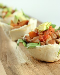 Tortilla cups filled with a spicy pinto bean salad.