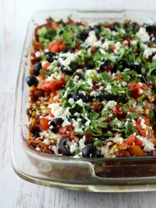 A Mexican Casserole made with Randall's Pinto Beans in a glass casserole dish.