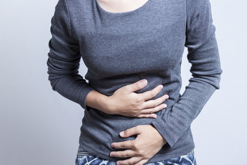woman with stomach ache from not maintaining good gut health