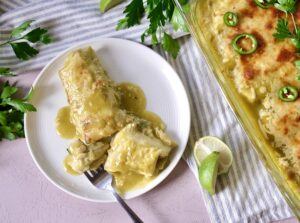 these great northern bean and chicken enchiladas are a simple, delicious, and inexpensive weeknight meal.
